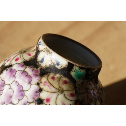 5 - Pair of 19th Century hand enamelled Chinese tea bowls, decorated with florals on a black ground. Bot... 