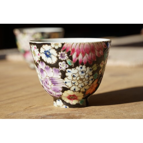 5 - Pair of 19th Century hand enamelled Chinese tea bowls, decorated with florals on a black ground. Bot... 