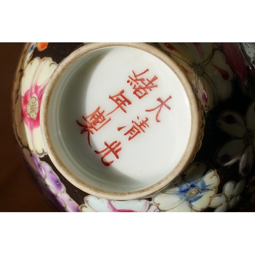 5 - Pair of 19th Century hand enamelled Chinese tea bowls, decorated with florals on a black ground. Bot... 