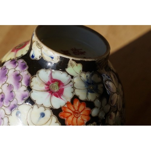 5 - Pair of 19th Century hand enamelled Chinese tea bowls, decorated with florals on a black ground. Bot... 