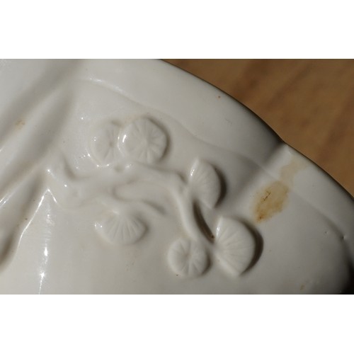 19 - Chinese Kangxi blanc de chine vase having a scalloped rim, with moulded deer, dragon and prunus deta... 