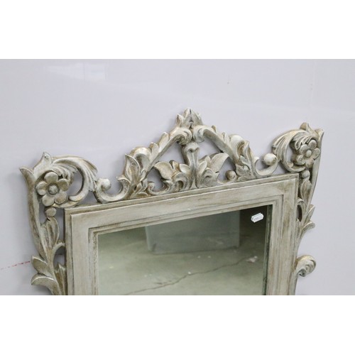 678A - Large composite orante framed mirror with foliate design, measures 94cm x 65.5cm