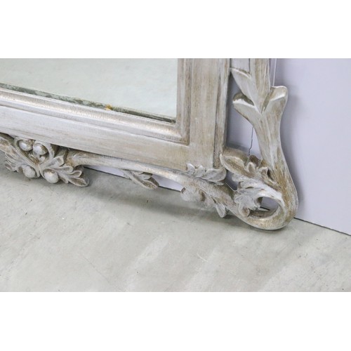 678A - Large composite orante framed mirror with foliate design, measures 94cm x 65.5cm