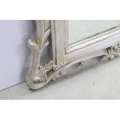 678A - Large composite orante framed mirror with foliate design, measures 94cm x 65.5cm