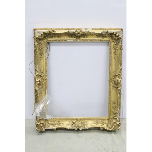 691A - Late 19th / Early 20th Century gilt picture frame with ornately moulded border, measures 67cm x 56cm... 