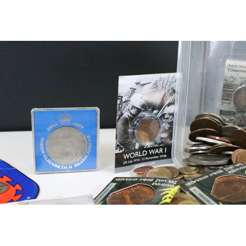 238 - A collection of mainly British pre decimal and world coins to include some silver examples together ... 