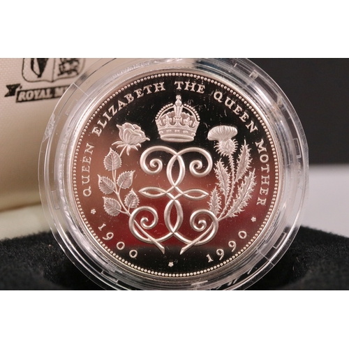 210 - A collection of four Royal Mint United Kingdom silver proof commemorative crown coins to include the... 