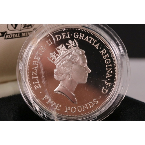 210 - A collection of four Royal Mint United Kingdom silver proof commemorative crown coins to include the... 