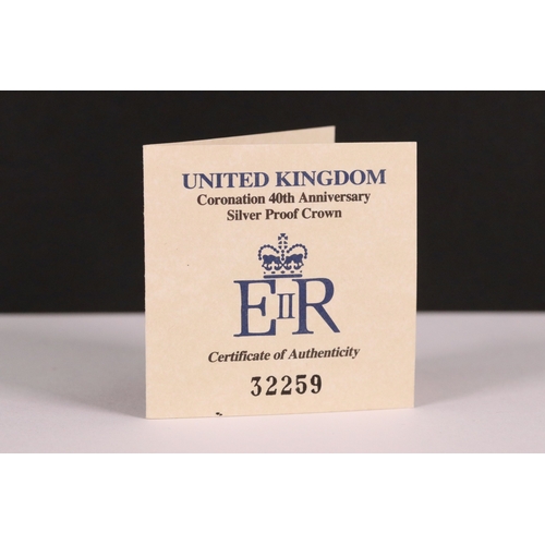 210 - A collection of four Royal Mint United Kingdom silver proof commemorative crown coins to include the... 