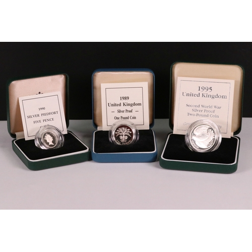 212 - A collection of three Royal Mint United Kingdom silver proof coins to include the 1995 second world ... 