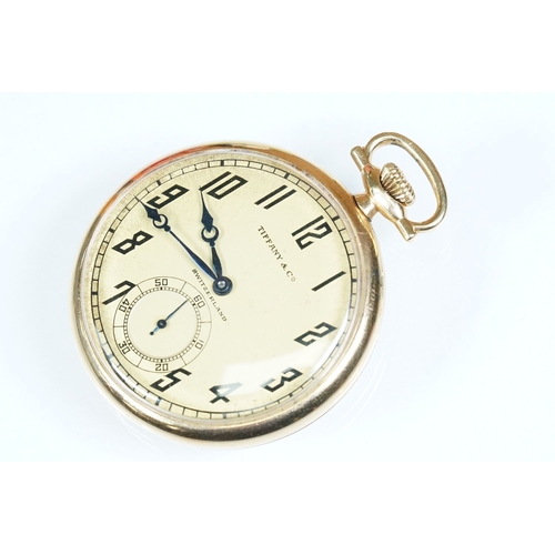 386A - Tiffany & Co 18ct gold Art Deco open face pocket watch having a gilt face with arabic numerals to th... 