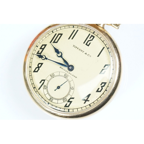 386A - Tiffany & Co 18ct gold Art Deco open face pocket watch having a gilt face with arabic numerals to th... 