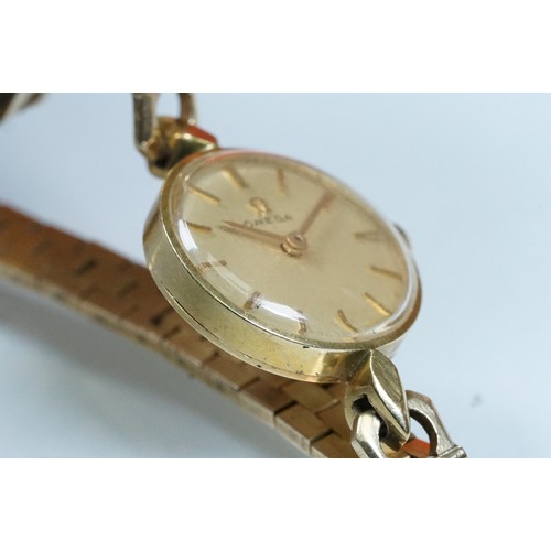 393 - Ladies Omega dress watch having a round face with gilt dial and baton markers to the chapter ring wi... 