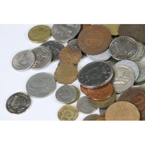 307 - A collection of British pre decimal and world coins to include a small quantity of silver and a quan... 