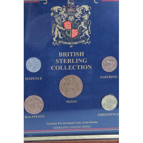 308 - A collection of four framed and glazed coin sets to include the Royalty and Empire collection, the H... 