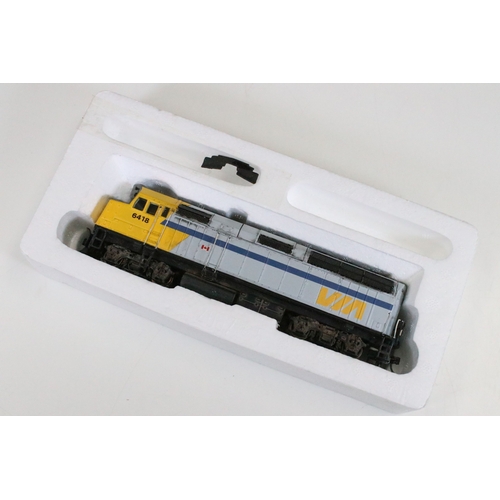 46 - Six boxed HO gauge locomotives to include 2 x Tramline 931-308 EMD F40PH Via Rail, 2 x Proto 1000 Se... 