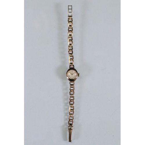 386 - 9ct gold Hefik 9ct gold wrist watch having a round face with arabic numerals to the chapter ring wit... 