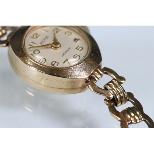 386 - 9ct gold Hefik 9ct gold wrist watch having a round face with arabic numerals to the chapter ring wit... 