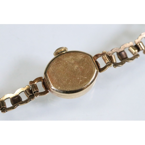 386 - 9ct gold Hefik 9ct gold wrist watch having a round face with arabic numerals to the chapter ring wit... 