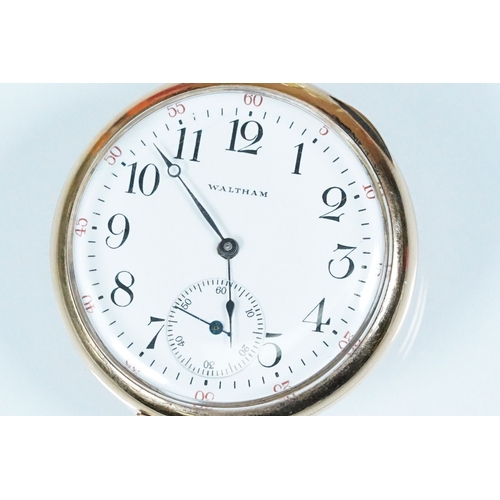 392A - Waltham USA gold plated open face pocket watch having a white enamelled face with arabic numerals to... 