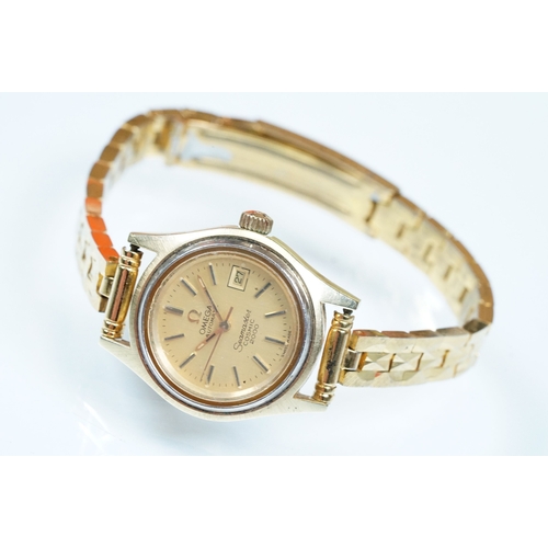 394 - Omega Seamaster Cosmic 2000 wrist watch having a round face with a gilt face with baton markers to t... 