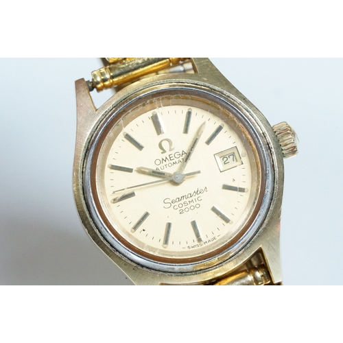 394 - Omega Seamaster Cosmic 2000 wrist watch having a round face with a gilt face with baton markers to t... 