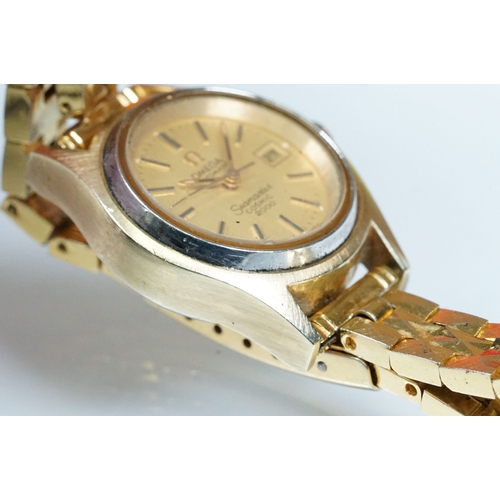 394 - Omega Seamaster Cosmic 2000 wrist watch having a round face with a gilt face with baton markers to t... 