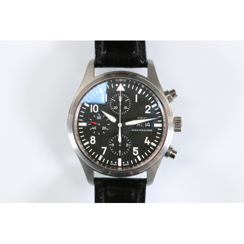 396 - IWC chronograph pilots watch having a round face with black dial, with which arabic numerals to the ... 