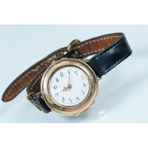 435 - 14ct gold 1920s wrist watch having a white enamelled dial with arabic numerals to the chapter ring a... 