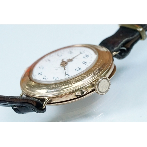 435 - 14ct gold 1920s wrist watch having a white enamelled dial with arabic numerals to the chapter ring a... 