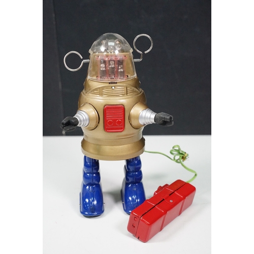 279 - Two boxed tin plate and plastic robots to include Ha Ha Toy Battery Operated Remote Control Piston A... 
