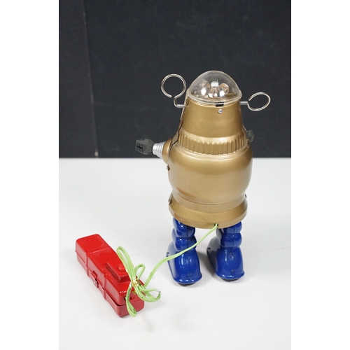 279 - Two boxed tin plate and plastic robots to include Ha Ha Toy Battery Operated Remote Control Piston A... 