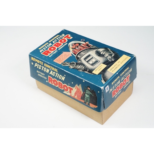 279 - Two boxed tin plate and plastic robots to include Ha Ha Toy Battery Operated Remote Control Piston A... 