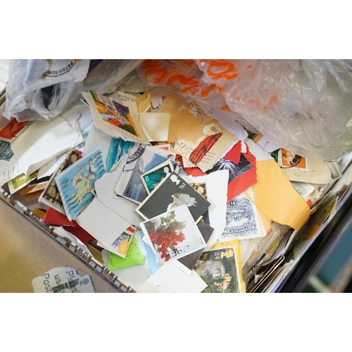 409 - Collection of stamps to include 25 presentation packs mint stamps and a large quantity of kilo ware ... 