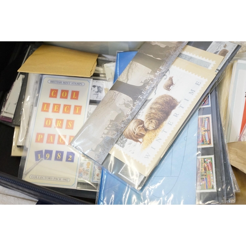 409 - Collection of stamps to include 25 presentation packs mint stamps and a large quantity of kilo ware ... 