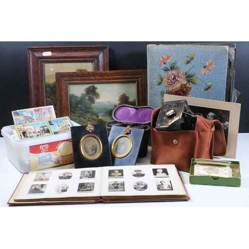 412 - Collection of cigarette cards within albums to include Ogdens examples, Early 20th Century postcards... 