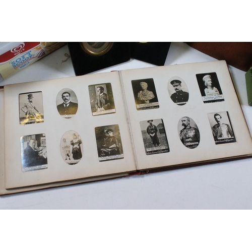 412 - Collection of cigarette cards within albums to include Ogdens examples, Early 20th Century postcards... 