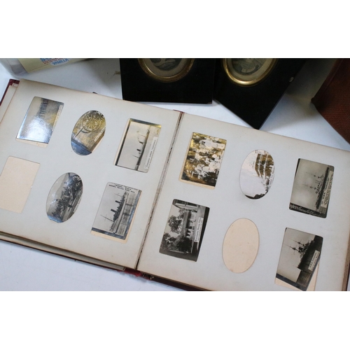 412 - Collection of cigarette cards within albums to include Ogdens examples, Early 20th Century postcards... 