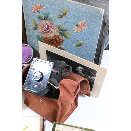 412 - Collection of cigarette cards within albums to include Ogdens examples, Early 20th Century postcards... 