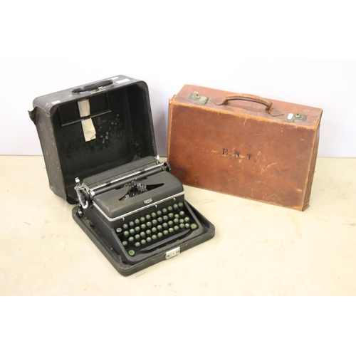 431 - Leather travelling suitcase with initials E.N.T. to top, together with a Royal portable model c type... 