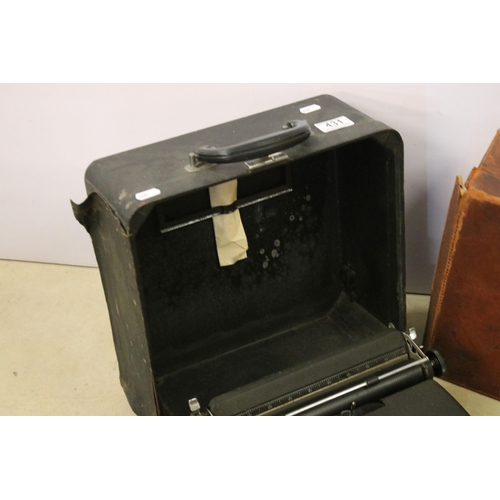 431 - Leather travelling suitcase with initials E.N.T. to top, together with a Royal portable model c type... 