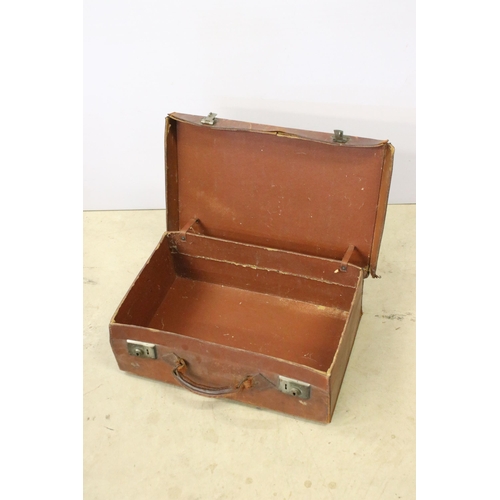 431 - Leather travelling suitcase with initials E.N.T. to top, together with a Royal portable model c type... 