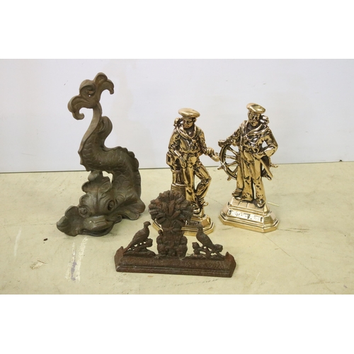 445 - Four cast iron and brass door stops to include 2 x brass Britains Pride examples, cast iron Chinese ... 