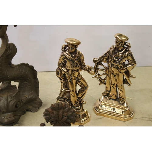 445 - Four cast iron and brass door stops to include 2 x brass Britains Pride examples, cast iron Chinese ... 