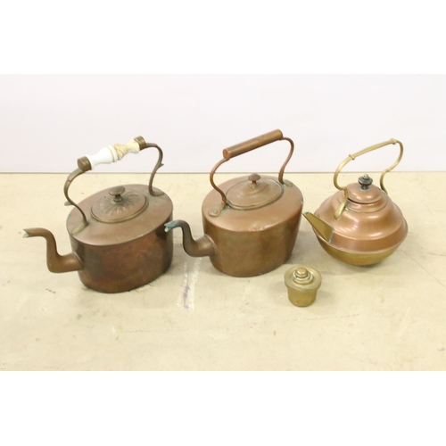 451 - Collection of three copper teapots, one with enamel handle, one with brass handle and spout and one ... 