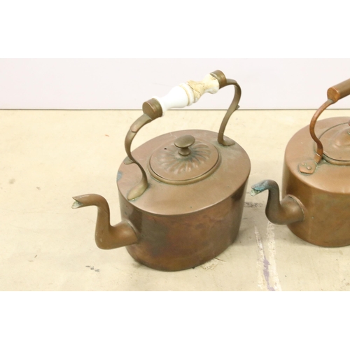 451 - Collection of three copper teapots, one with enamel handle, one with brass handle and spout and one ... 