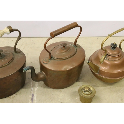 451 - Collection of three copper teapots, one with enamel handle, one with brass handle and spout and one ... 