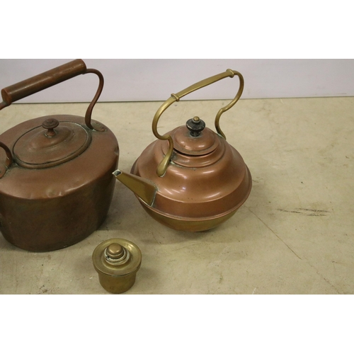 451 - Collection of three copper teapots, one with enamel handle, one with brass handle and spout and one ... 