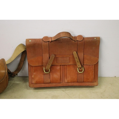454 - Three leather bags to include two brief cases and a satchel.