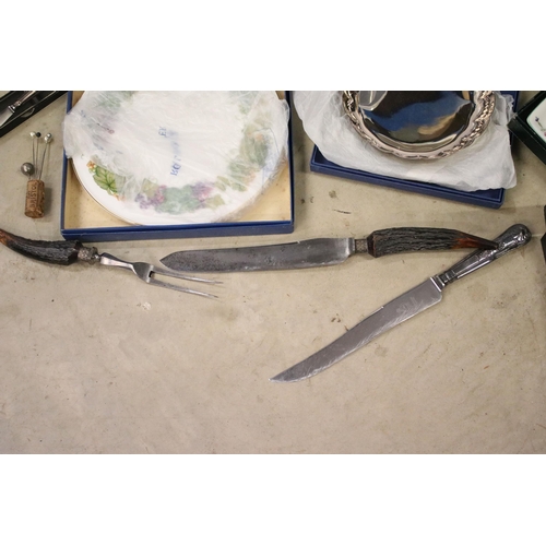 472 - Collection of silver plated cutlery to include a shell pattern cutlery canteen, antler handled carvi... 